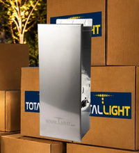 Load image into Gallery viewer, A tall, brushed-metal rectangular product stands in front of stacked brown cardboard boxes. The front box has a blue and yellow TotalLight logo sticker, and the product itself appears branded with 'ROYAL-LIGHT' near the bottom.